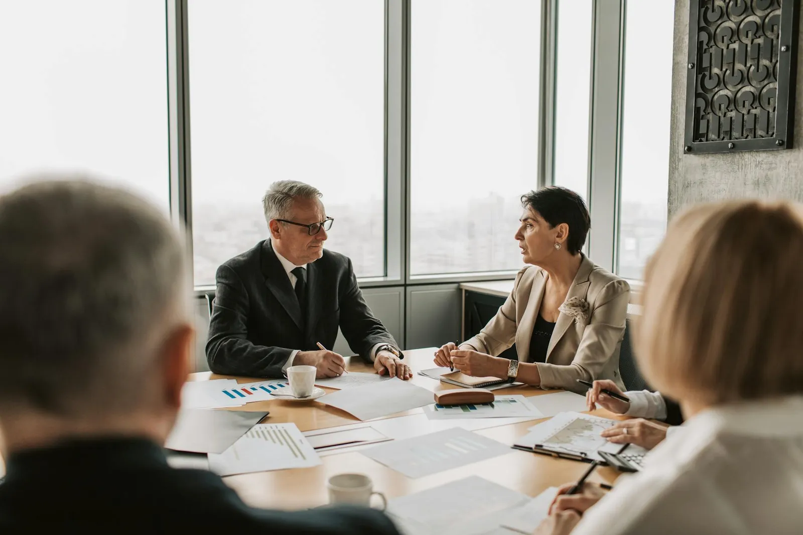 Professionals meeting to discuss a childcare business transaction